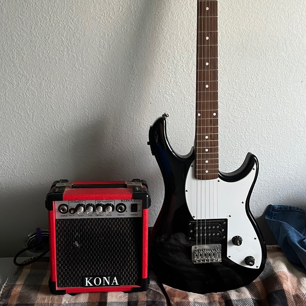 electric guitar with amp (doesn’t come with connector for amp and guitar)